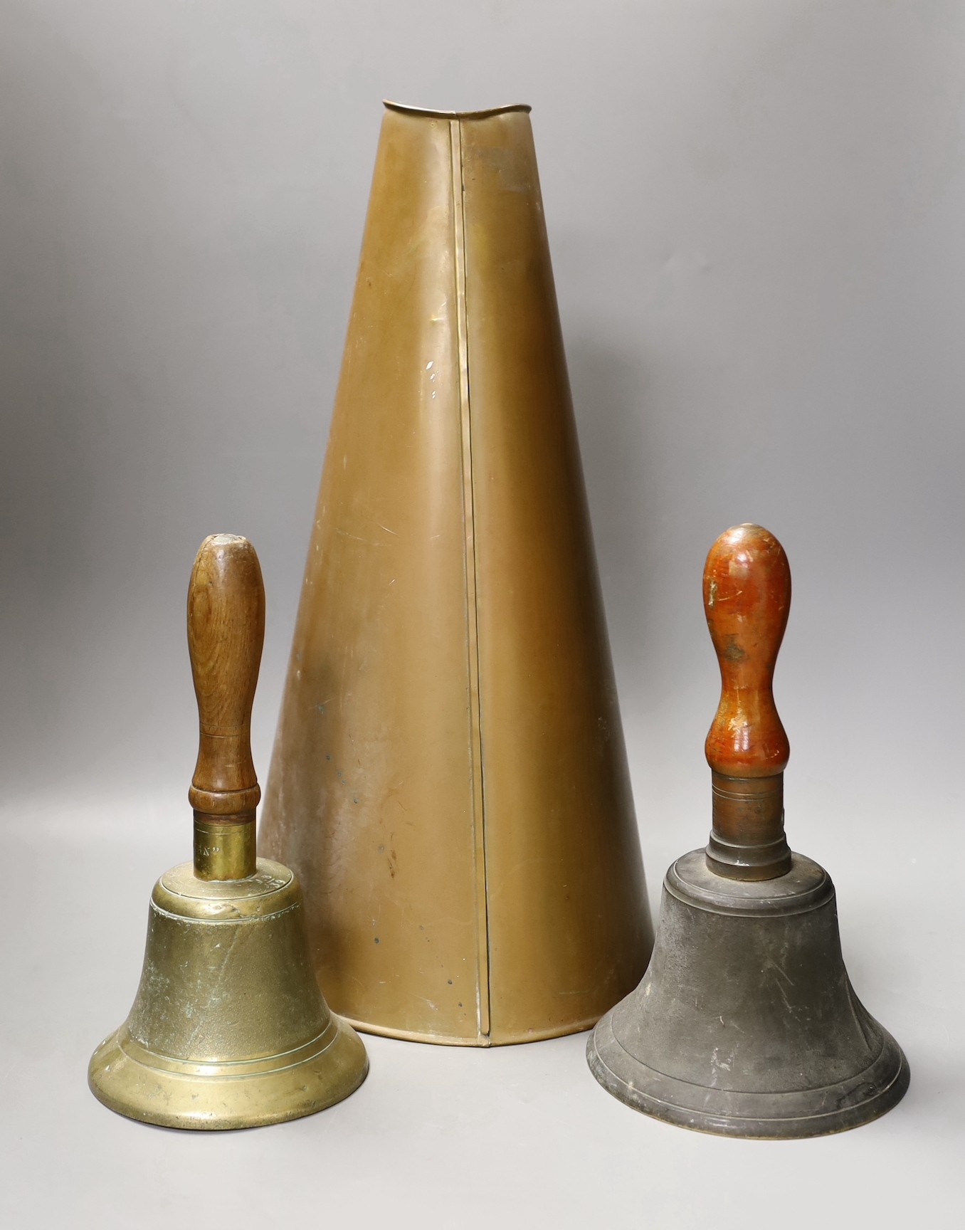 Two World War Two hand-bells, 26cm, and a brass wartime loud-haler